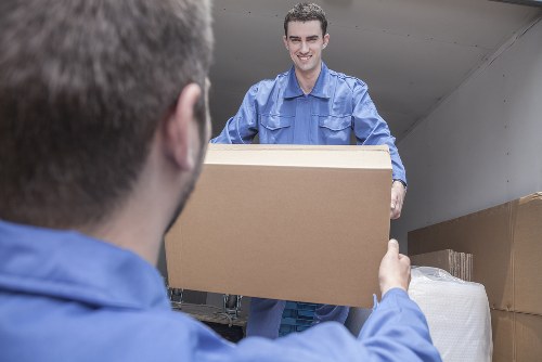 Loading furniture into a moving truck in Poplar