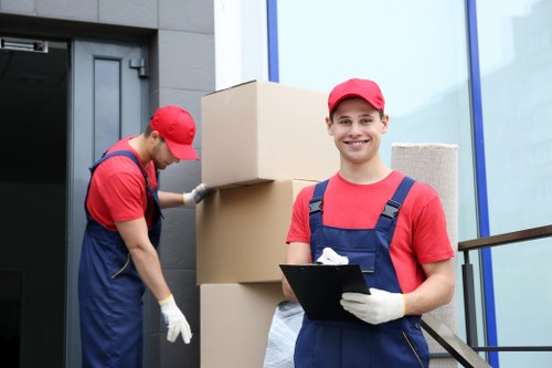Man and van removals team loading furniture in Poplar