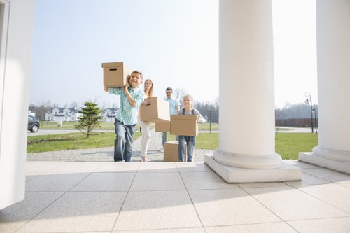 House movers working near residential buildings in Poplar