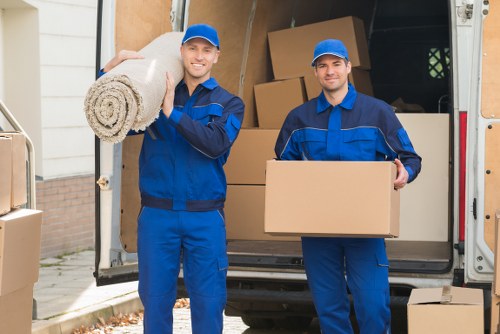 Local movers loading furniture for a Poplar home relocation
