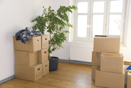 Local removals crew handling household items in East London