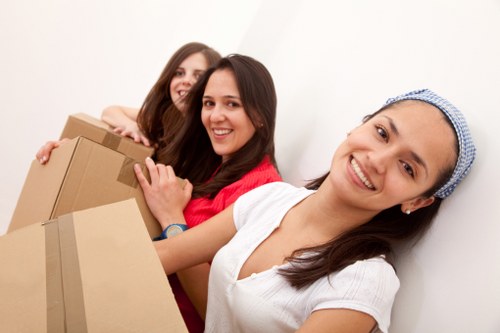 Packed boxes and furniture ready for a removals job in Poplar