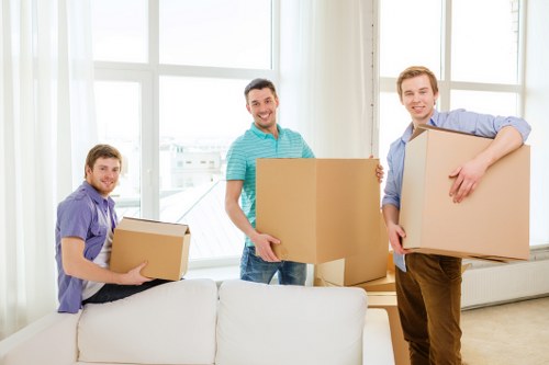 Unpacking boxes and arranging items in a new Poplar home