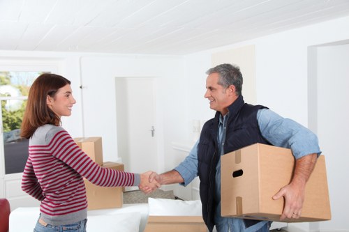Professional movers handling a flat relocation in Poplar