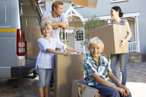 Local van service loading furniture near Poplar homes