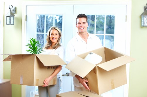 Organised office furniture and IT items prepared for transport