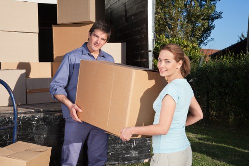 Removal van and moving team handling a Poplar flat move